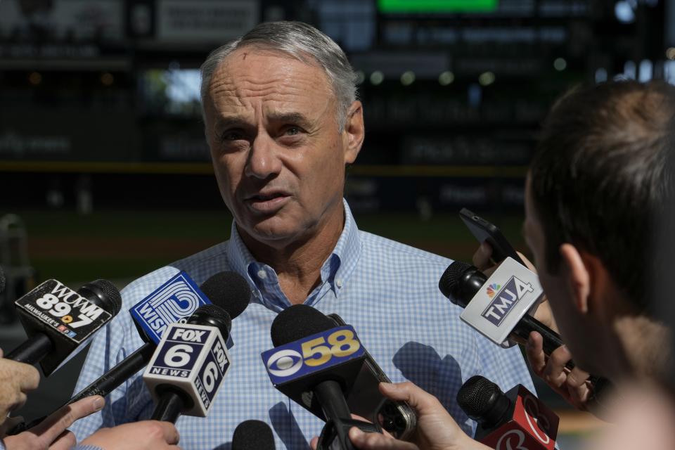 Major League Baseball Commissioner Rob Manfred answers quesions before a baseball game between the Milwaukee Brewers and the San Francisco Giants Thursday, May 25, 2023, in Milwaukee. (AP Photo/Morry Gash)
