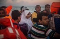 <p>Refugees and migrants overcrowd a wood boat during a rescue operation on the Mediterranean sea, about 19 miles north of Az Zawiyah, Libya, on Thursday, July 21, 2016. (AP Photo/Santi Palacios) </p>