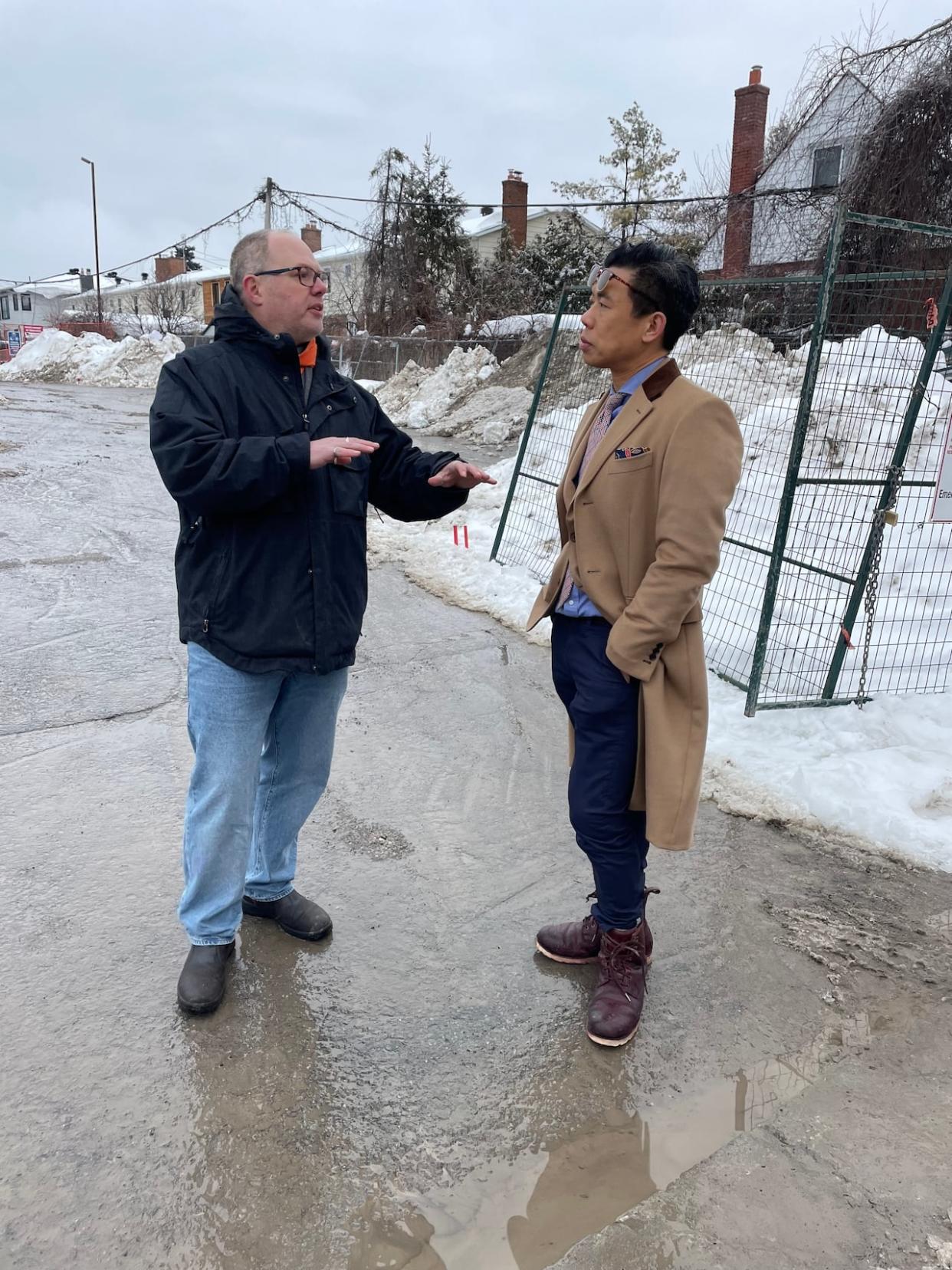 Architects Toon Dreessen, left, and Jay Lim, right, discuss the future of Carling Avenue and suggest ways to transform it from arterial thoroughfare to a stretch of livable neighbourhoods. (Mario Carlucci/CBC - image credit)