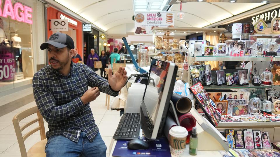 Latif Karim of the Photo Kiosk talking about business so far on Black Friday at the Willowbrook Mall in Wayne, NJ on November 25, 2022.