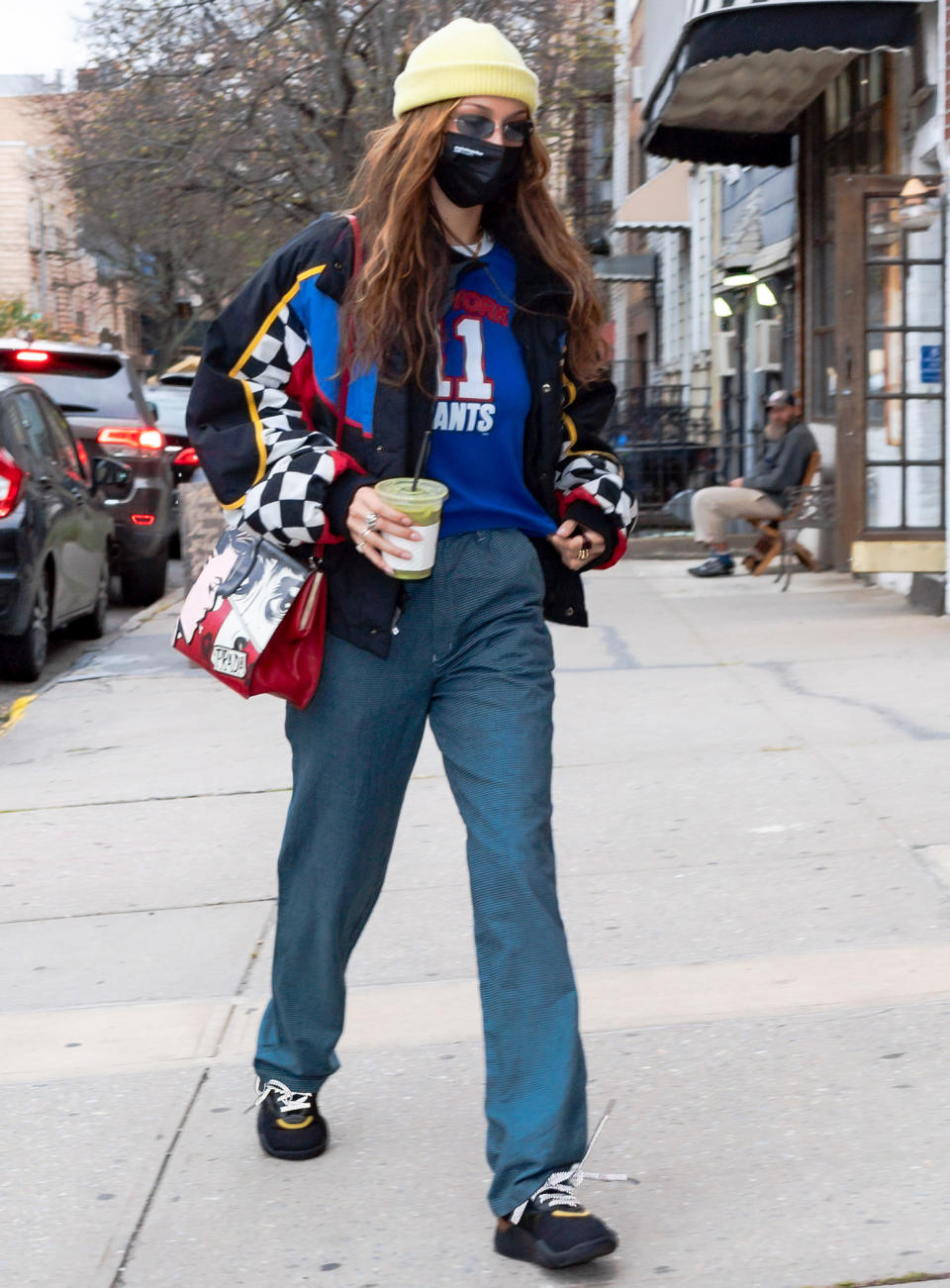 <p>Bella Hadid arrives at a vintage clothing store in Brooklyn, wearing a yellow beanie and an oversized jacket, on Tuesday.</p>