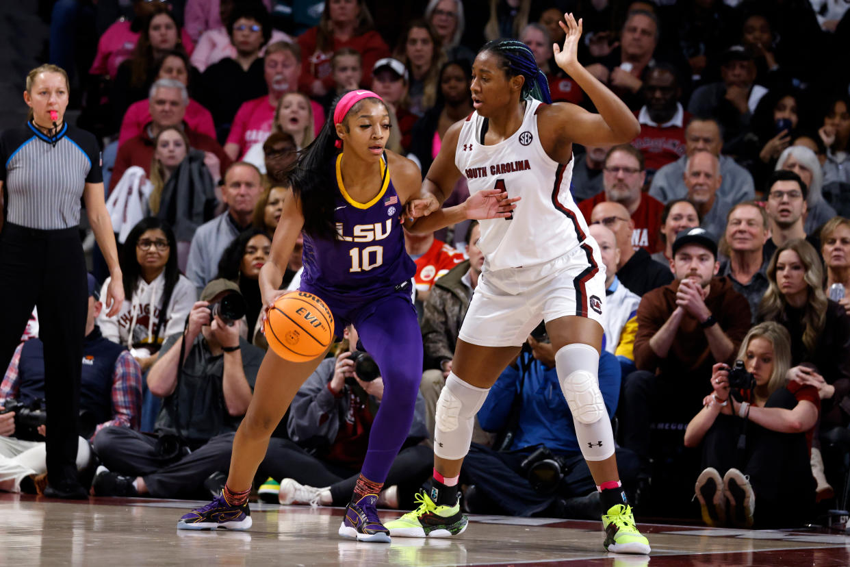 LSU's Angel Reese moves the ball against South Carolina's Aliyah Boston during the first quarter of their top-five matchup at Colonial Life Arena in Columbia, South Carolina, on Feb. 12, 2023. (Lance King/Getty Images)
