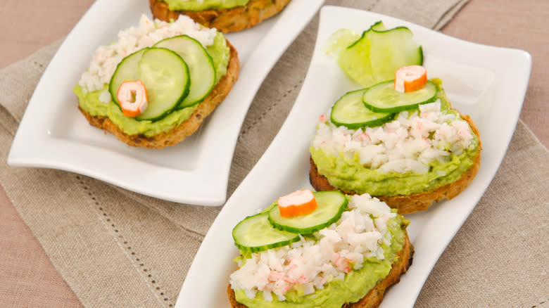 Plated avocado seafood toast