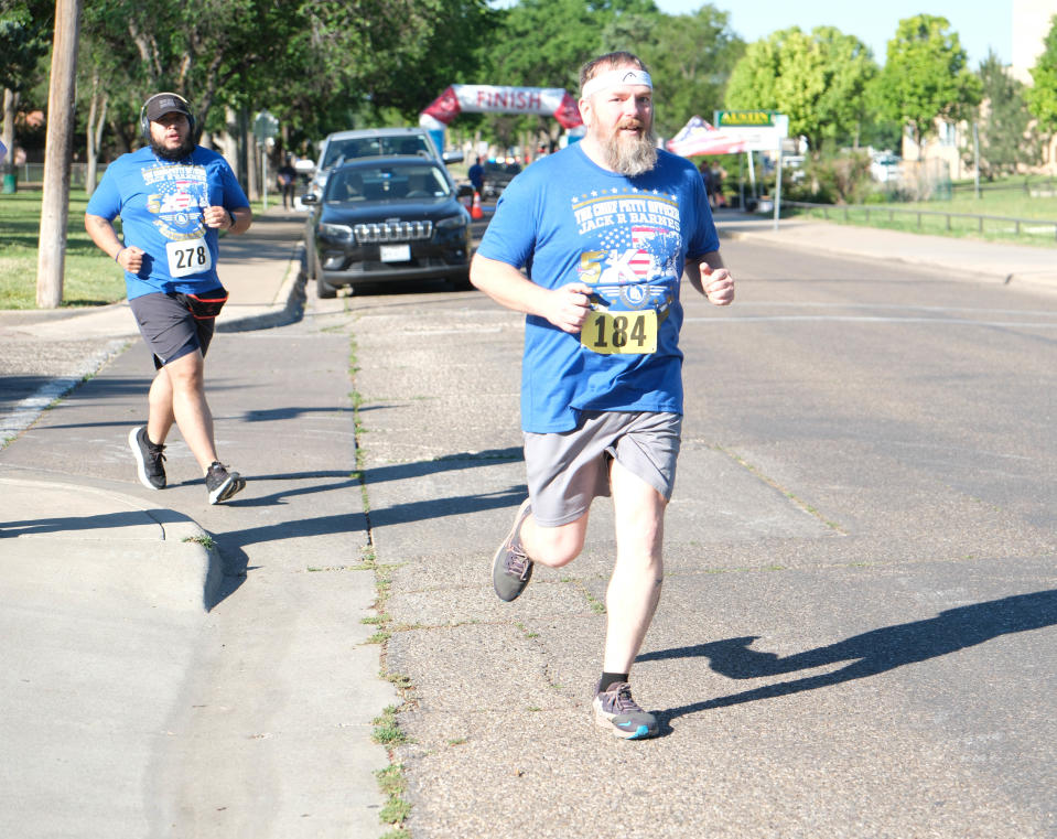 Runners come out of the turn of the first leg of the Chief Petty Officer Jack R. Barnes Run For the Fallen Saturday morning at Stephen F Austin Park in Amarillo.
