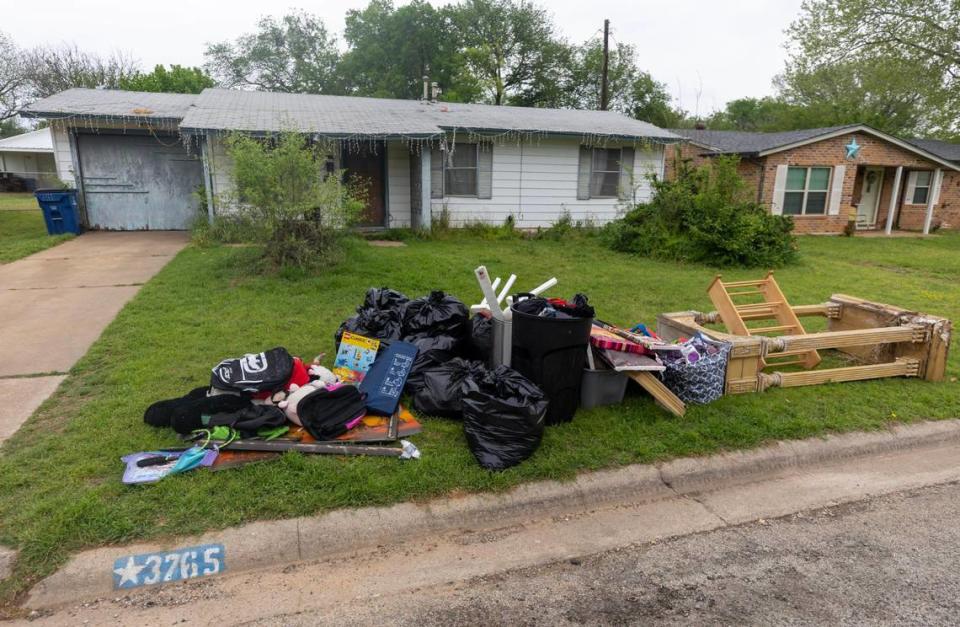 Items are left for trash pick-up outside of the last known residence of Noel Rodriguez-Alvarez in Everman, Texas, on Tuesday, April 4, 2023. Some furniture and toys are from the bedrooms Noel and his six siblings shared.