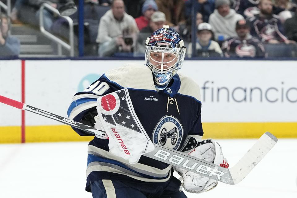 Feb 14, 2023; Columbus, Ohio, USA;  Columbus Blue Jackets goaltender Elvis Merzlikins (90) makes a save during the second period of the NHL hockey game against the New Jersey Devils at Nationwide Arena. Mandatory Credit: Adam Cairns-The Columbus Dispatch