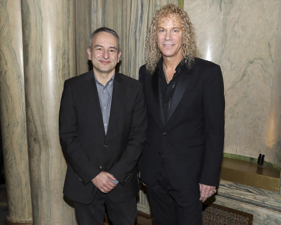 FILE - This Jan. 30, 2020 file photo shows playwright Joe DiPietro, left, and David Bryan participate in a "Diana" Broadway musical cast special performance in New York. Bryan, the keyboardist for Bon Jovi is embarking on a busy 2020, with a new album and tour with one of America's favorite rock bands as well as opening his second Broadway musical, “Diana. (Photo by Greg Allen/Invision/AP, File)