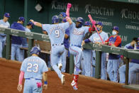 Texas Rangers Isiah Kiner-Falefa (9) celebrates with Adolis Garcia, right, after scoring on a double by Willie Calhoun during the fifth inning of a baseball game against the Seattle Mariners, Sunday, May 9, 2021, in Arlington, Texas. (AP Photo/Michael Ainsworth)
