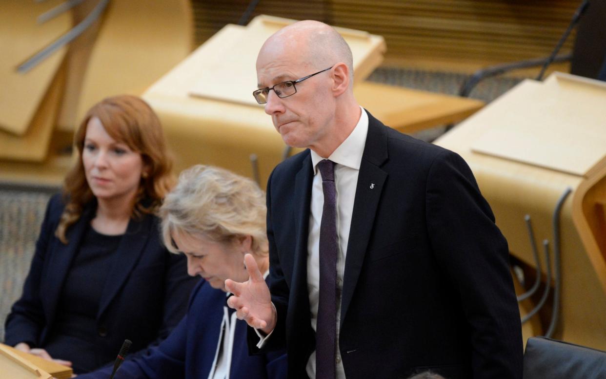 Scottish Education Secretary John Swinney during a debate in the Scottish Parliament, where he is under pressure to scrap testing of Primary One pupils - Corbis News