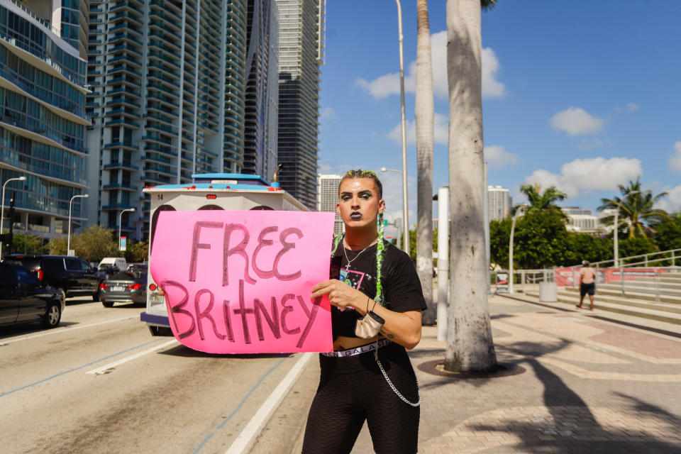 A supporter of Britney Spears holds a sign during a #FreeBritney protest outside American Airlines Arena on Feb. 11, 2021, in Miami.