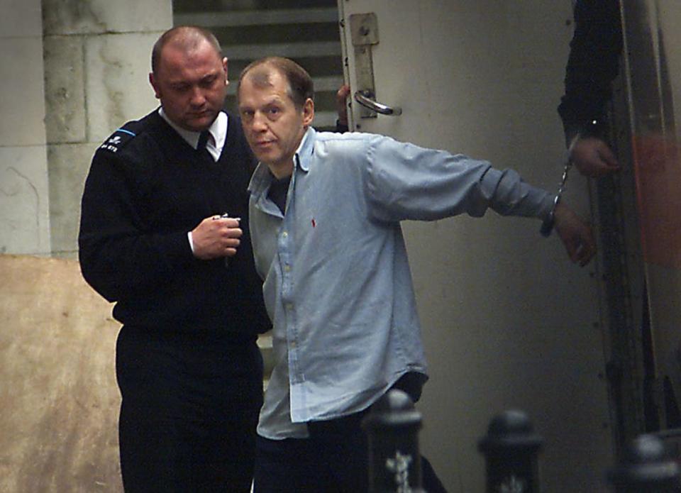 <div class="inline-image__caption"><p>Convicted murderer Michael Stone is led in handcuffs from a prison van to the Royal Courts of Justice in central London February 5, 2001.</p></div> <div class="inline-image__credit">Reuters</div>