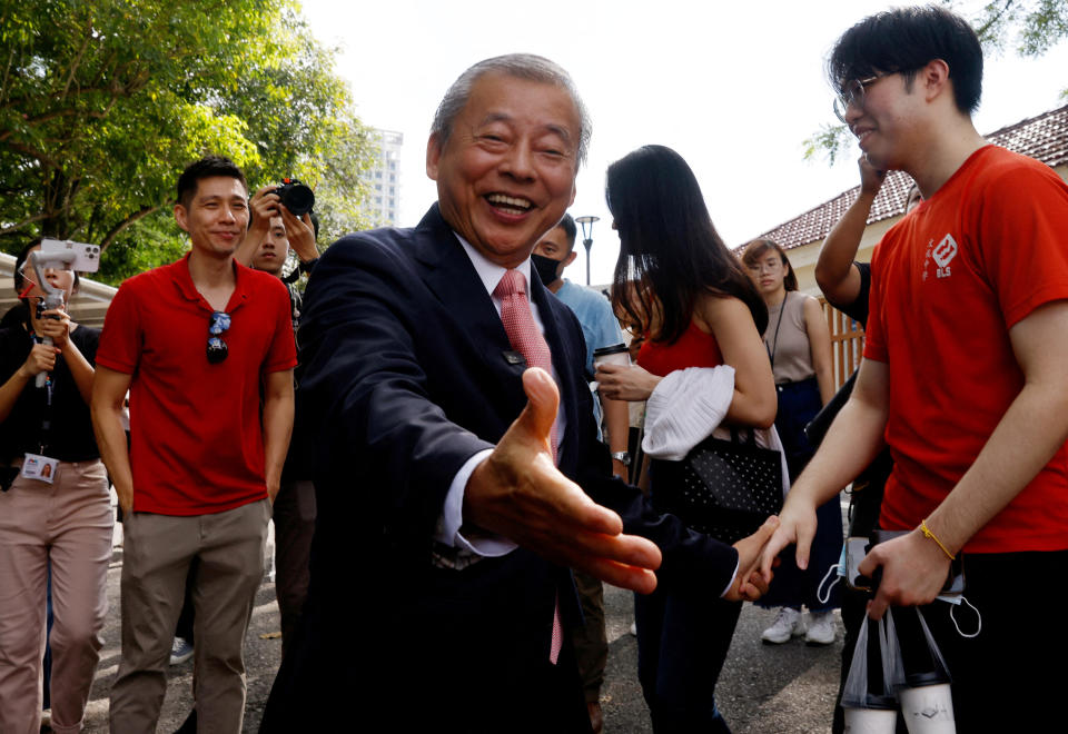 Potential presidential candidate George Goh greets supporters at the Elections Department in Singapore. 