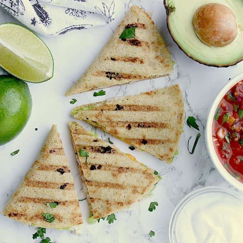 <p>Mama Bear's Cookbook</p><p>This quesadilla is loaded with chicken, avocado & cheese. Have it ready in ten minutes for a deliciously guilt-free quick meal!</p><p><strong>Get the recipe:</strong><a href="https://mamabearscookbook.com/low-carb-quesadilla-chicken-avocado/" rel="nofollow noopener" target="_blank" data-ylk="slk:Keto Quesadilla with Chicken & Avocado;elm:context_link;itc:0;sec:content-canvas" class="link "> <strong>Keto Quesadilla with Chicken & Avocado</strong></a></p>