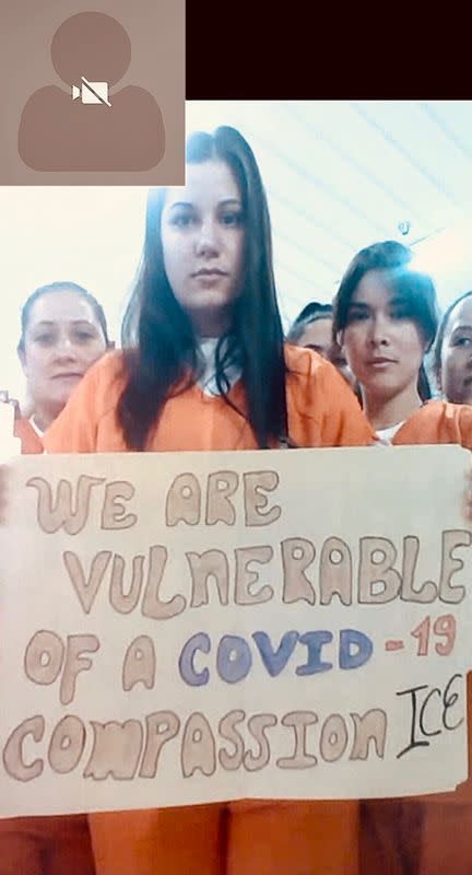 Migrants detained in an ICE detention facility in rural Louisiana display signs related to coronavirus disease