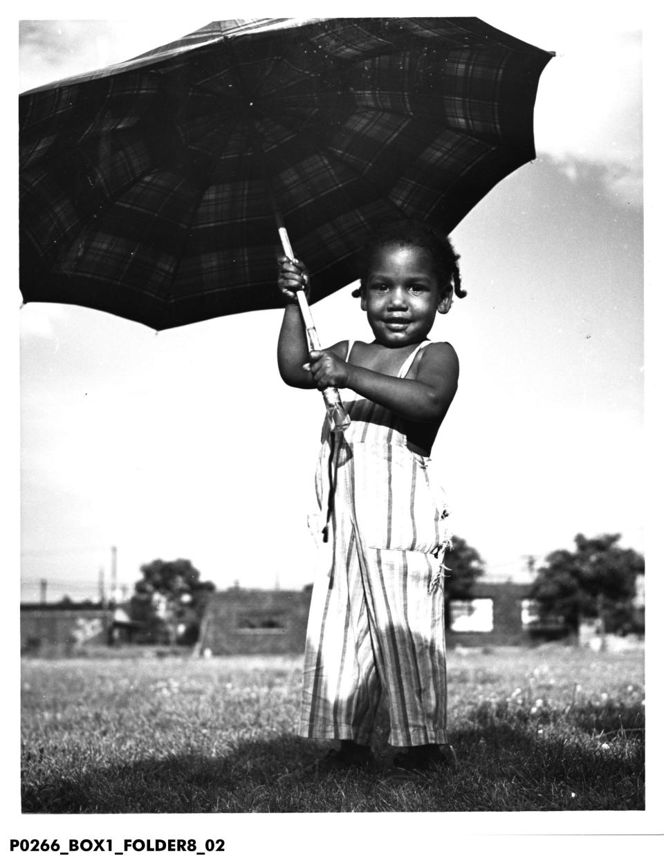 Photojournalist Oscar James Fox captured images of Indy's near west side, along the Canal and around Indiana Avenue, from 1945-1960. Here is a photograph titled "Little Girl With a Big Umbrella." Fox's photos preserve a period and place later erased by urban renewal and redevelopment plans.