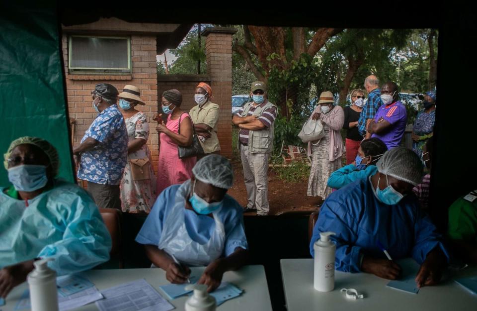 PHOTO: Elderly people queue for the Sinopharm COVID-19 vaccination outside the tent while nurses conduct their duties at a local hospital on March 29, 2021, in Harare, Zimbabwe. (Tafadzwa Ufumeli/Getty Images)