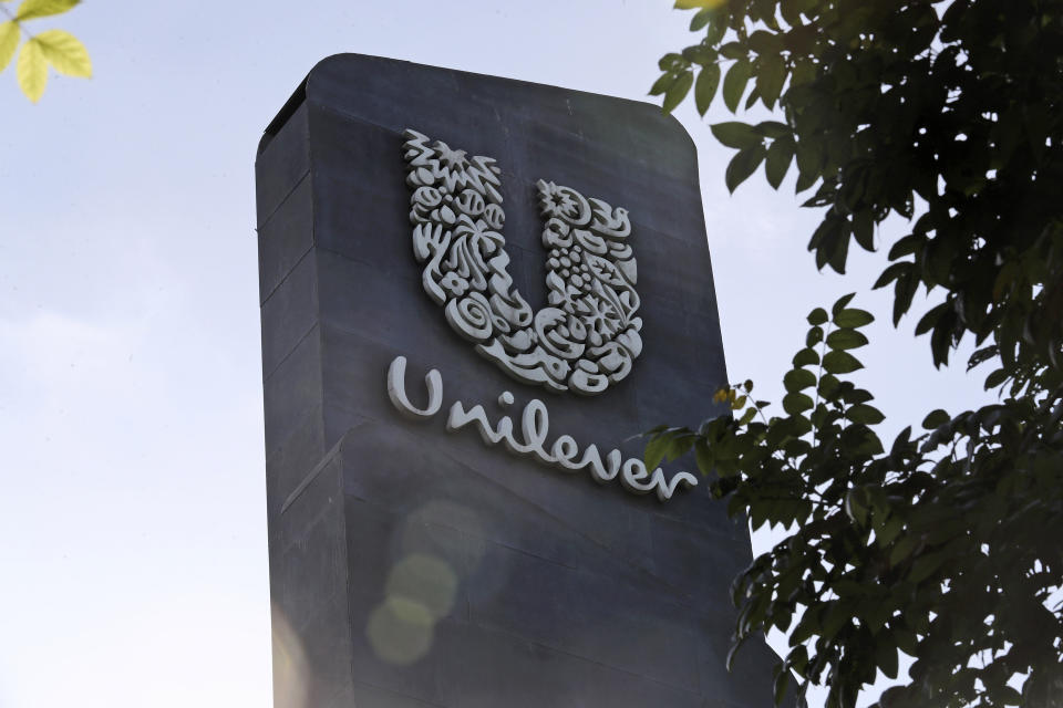 A Unilever logo is displayed outside a head office 