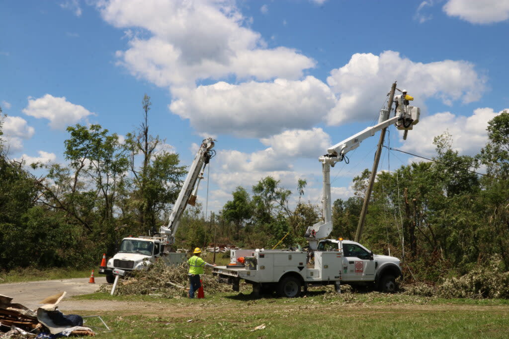 Utility workers installing new electricity lines.