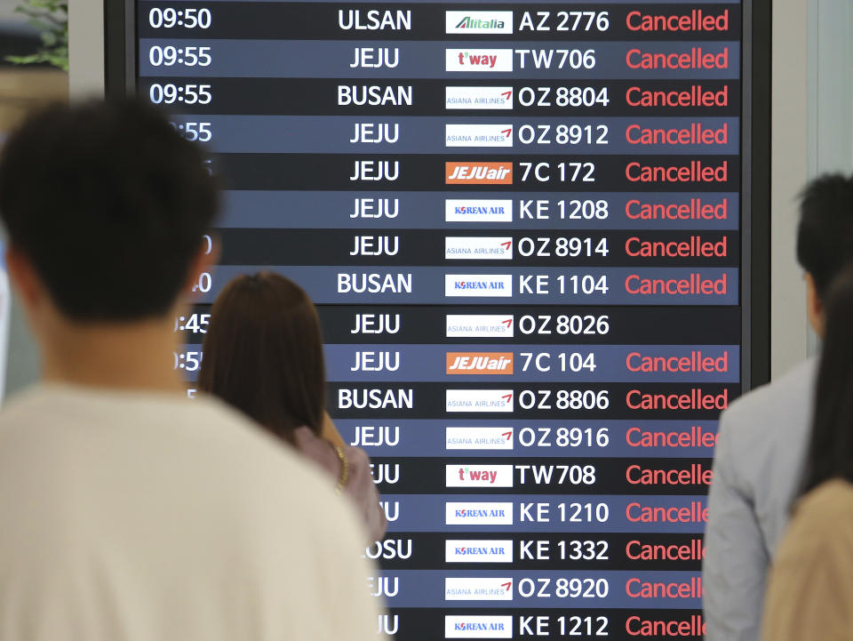 An electronic signboard shows canceled domestic flights at the Gimpo International Airport in Seoul, South Korea, Saturday, Sept. 7, 2019. Typhoon winds toppled trees, grounded planes and left thousands of South Korean homes without electricity on Saturday as a powerful storm system brushed up against the Korean Peninsula. (AP Photo/Ahn Young-joon)