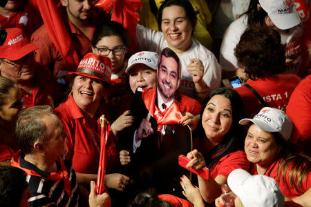 Supporters of Paraguay’s newly elected President Mario Abdo Benitez of the Colorado Party celebrate in Asuncion, Paraguay, April 22, 2018. REUTERS/Jorge Adorno