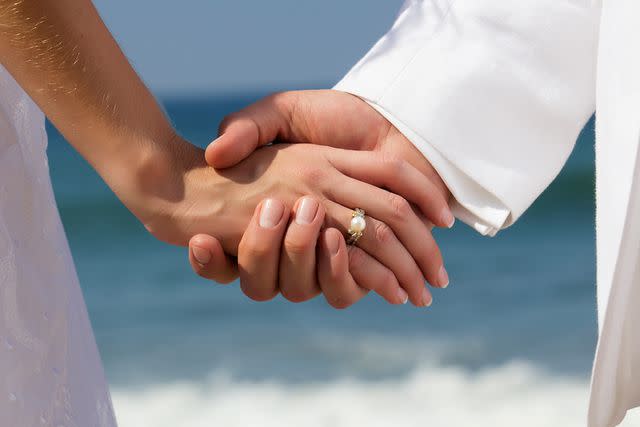 <p>Getty</p> Stock image of man and woman with pearl ring.