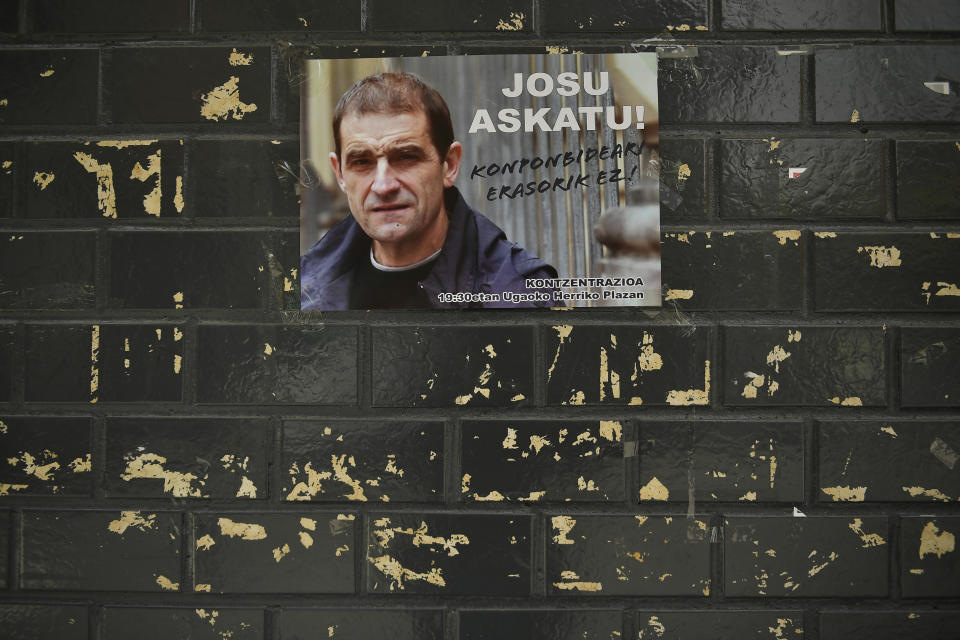 A poster with the face of Basque separatist militant Josu Ternera is attached to a wall in his home town of Ugao-Miraballes, Spain, Thursday, May 16, 2019. The most wanted member of the Basque separatist militant group ETA who had been on the run for 17 years was finally caught by police on Thursday May 16, 2019 in the French Alps. Jose Antonio Urruticoetxea Bengoetxea, known by the alias Josu Ternera, was a longtime chief of ETA and connected to some of its bloodiest episodes. The poster has a message written in the Basque language saying 'No solution to the solution' while calling for a protest gathering in the town this evening supporting him. (AP Photo/Alvaro Barrientos)