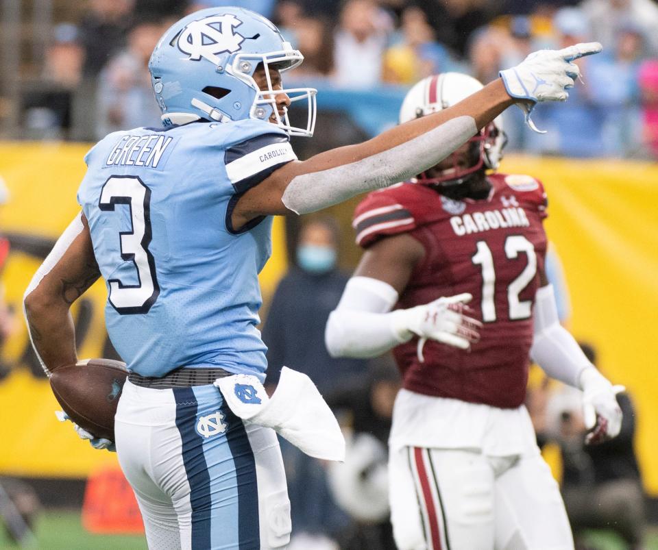 North Carolina receiver Antoine Green signals for a first down after making a catch against South Carolina in the Duke’s Mayo Bowl at Bank of America Stadium in December.