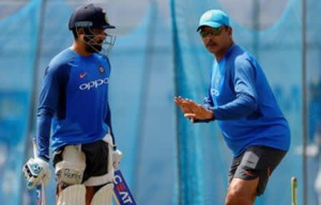 Cricket - Sri Lanka v India - India's Team Practice Session - Galle, Sri Lanka - July 25, 2017 - India's cricketer Rohit Sharma is advised by team's coach Ravi Shastri ahead of their first test match. REUTERS/Dinuka Liyanawatte