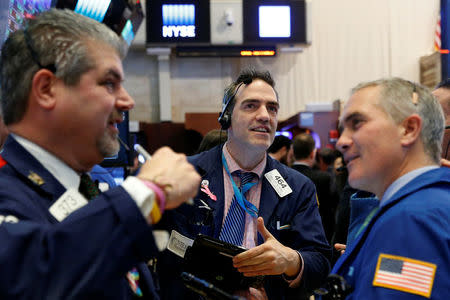 Traders work on the floor of the New York Stock Exchange (NYSE) in New York City, U.S., December 5, 2016. REUTERS/Brendan McDermid