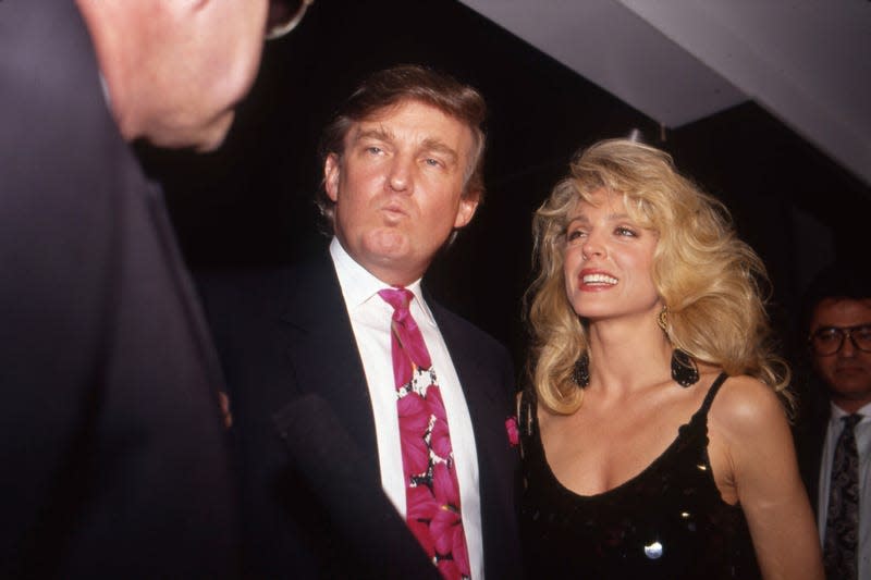 ATLANTIC CITY, NJ - APRIL 19: Donald Trump and Marla Maples attend the Evander Holyfield vs. George Foreman boxing match at the Trump Plaza Hotel and Casino.