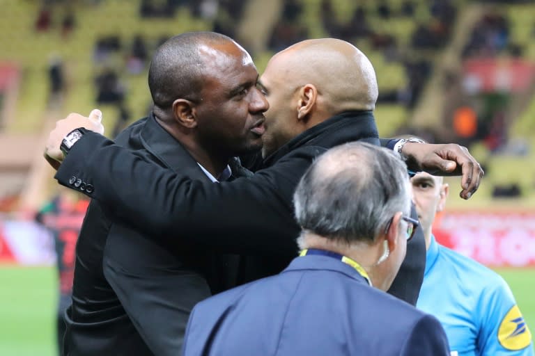 Thierry Henry embraces Patrick Vieira prior to Wednesday's clash between Monaco and Nice