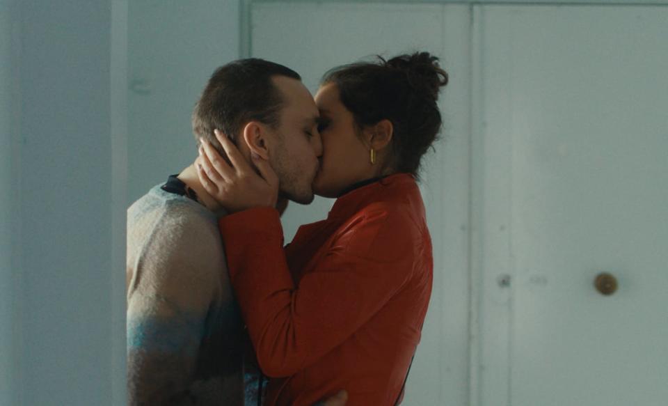 Franz Rogowski and Adèle Exarchopoulos kissing in a scene from Passages.