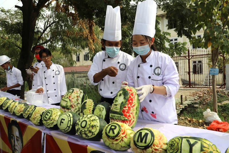 Carved watermelons showing the portrait of Aung San Suu Kyi are seen in Mandalay