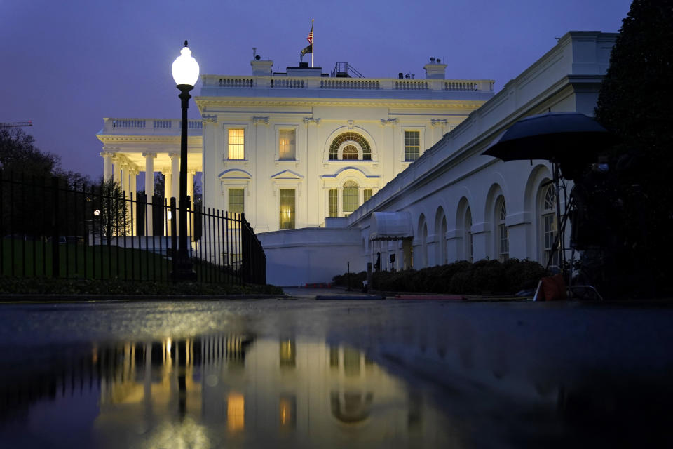 Lights shine from inside the White House at dusk, Wednesday, Nov. 11, 2020, in Washington. (AP Photo/Patrick Semansky)