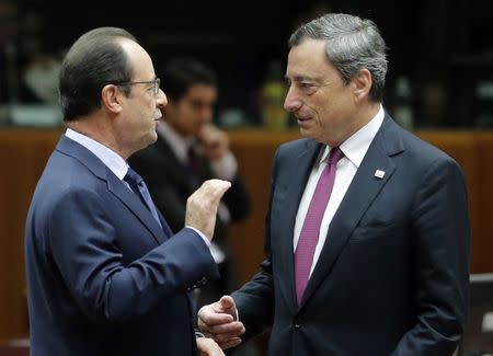 European Central Bank (ECB) President Mario Draghi (R) talks with France's President Francois Hollande as they arrive for a working session during an EU summit in Brussels October 24, 2014. REUTERS/Christian Hartmann