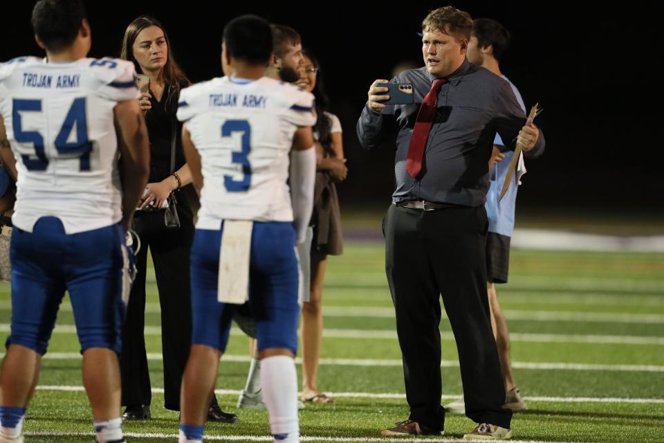 Record Searchlight sports reporter Ethan Hanson interviews football players from Orland following their game against Shasta on Friday, Sept. 15, 2023 in Redding.