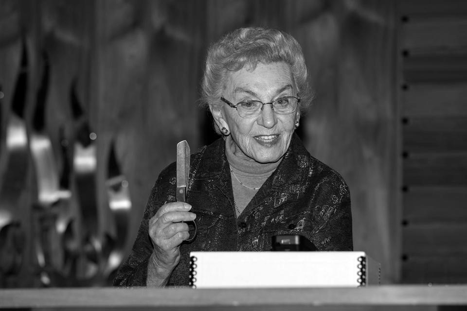 Celina Karp Biniaz holds her mother's sewing scissors, which came from Oskar Schindler's factory. She's shown on the day in 2019 when she donated the scissors to the Iowa Jewish Historical Society in Des Moines.