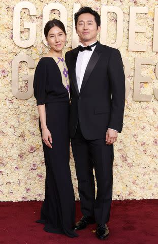 <p>Amy Sussman/Getty </p> Steven Yeun and wife Joana Pak