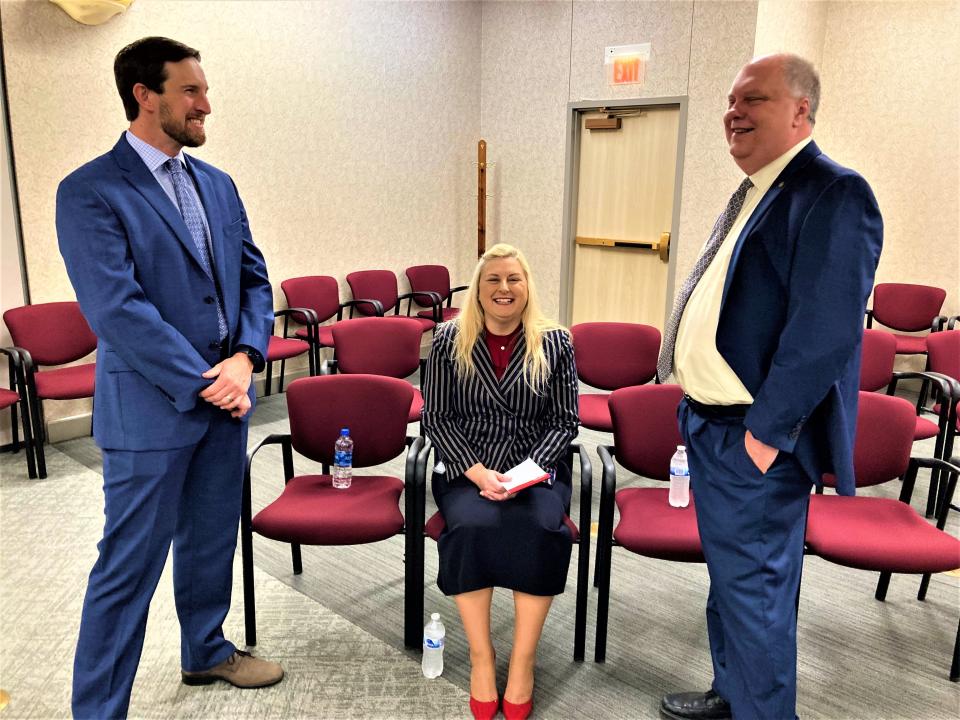 Rutherford County Schools director applicant finalists James Sullivan, left, Andrea Anthony, center, and John Ash, right, mingle before each took turns interviewing Thursday (May 19, 2022) with the Rutherford County Board of Education at the district's administration building in Murfreesboro.