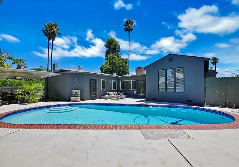 SHERMAN OAKS: This three-bedroom home on a corner lot features finishes such as whitewashed beams, Saltillo tile and stained-glass windows across a single story. Address: 14205 Collins St., Sherman Oaks, 91401 Listed for: $974,950 for three bedrooms, three bathrooms in 1,911 square feet (10,671-square-foot lot) Features: Spacious front yard; covered porch; den with pool access; trellis-topped patio