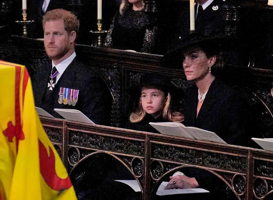 Britain's Prince Harry, Duke of Sussex, Britain's Princess Charlotte of Wales, Britain's Catherine, Princess of Wales, Britain's Prince George of Wales and Britain's Prince William, Prince of Wales attend the Committal Service for Britain's Queen Elizabeth II in St George's Chapel inside Windsor Castle on September 19, 2022.