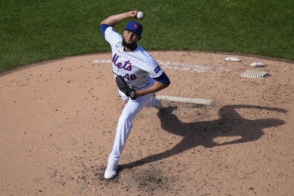 New York Mets' Yohan Ramirez pitches during the seventh inning of a baseball game against the Milwaukee Brewers, Sunday, March 31, 2024, in New York. (AP Photo/Frank Franklin II)