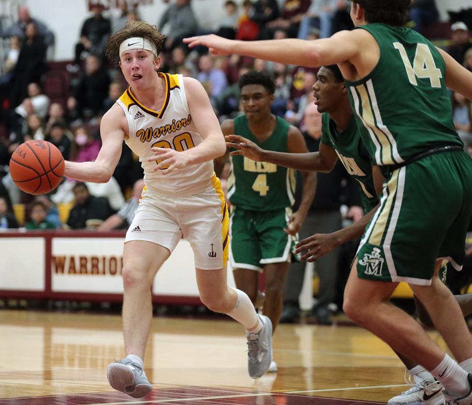 Walsh Jesuit forward Zach Halligan, left, makes a pass against STVM during the second half, Tuesday, Dec. 13, 2022.