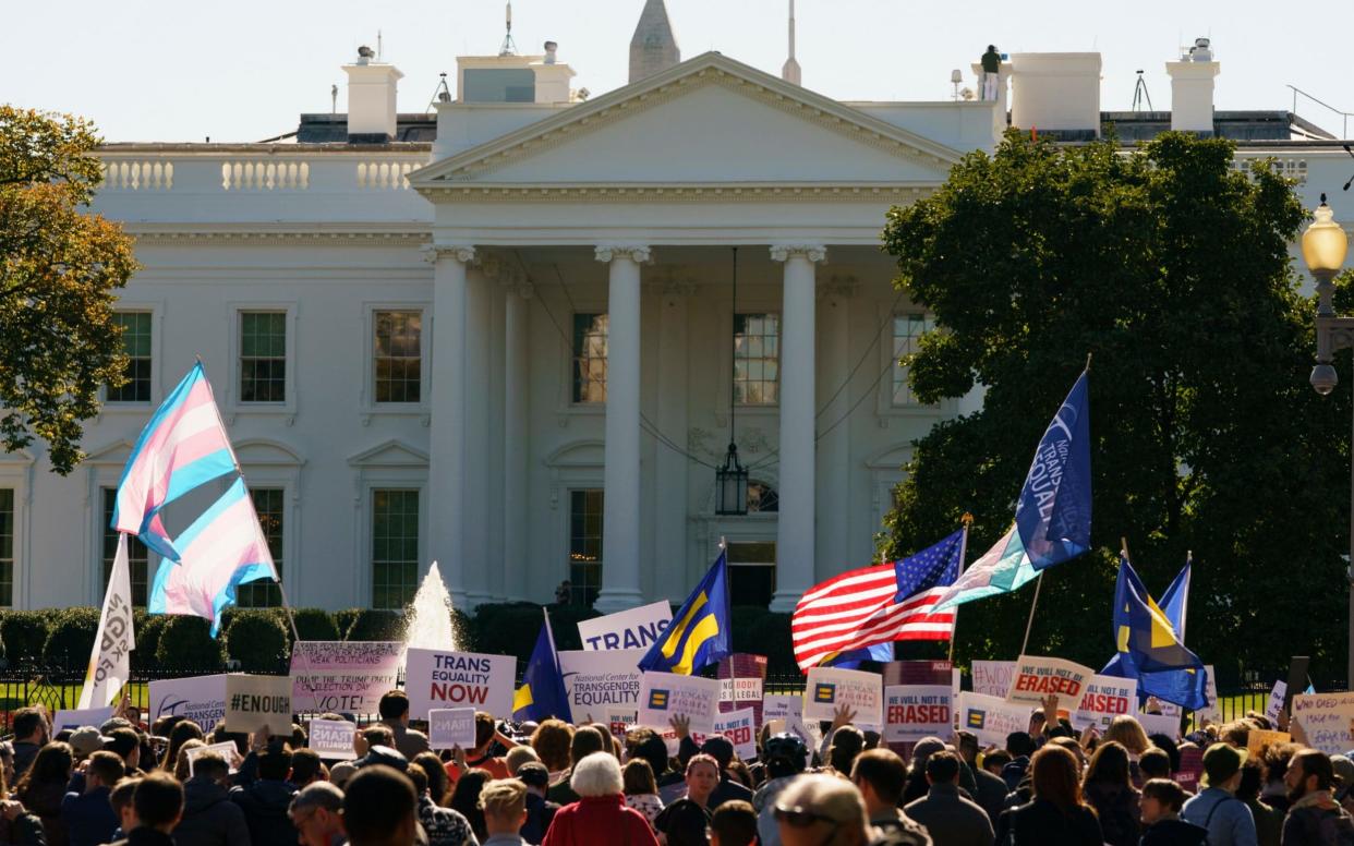 Transgender rights campaigners protest outside the White House - AP