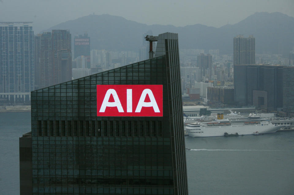 A panel on top of AIA Central, previously AIG Tower, flashes the company sign at Hong Kong's financial Central district February 12, 2010. American International Group has lined up all the major investment banks to underwrite the public listing of its Asian life insurance unit, in what may be Hong Kong's biggest IPO since 2006, banking sources said.   REUTERS/Bobby Yip  (CHINA - Tags: CITYSCAPE BUSINESS)