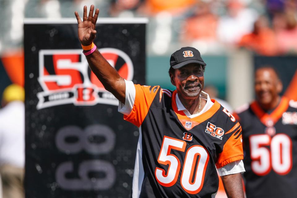 Former Cincinnati Bengals cornerback Ken Riley waves to the crowd during a halftime 50th anniversary ceremony of an NFL football game against the Baltimore Ravens, in Cincinnati, Sept. 10, 2017.