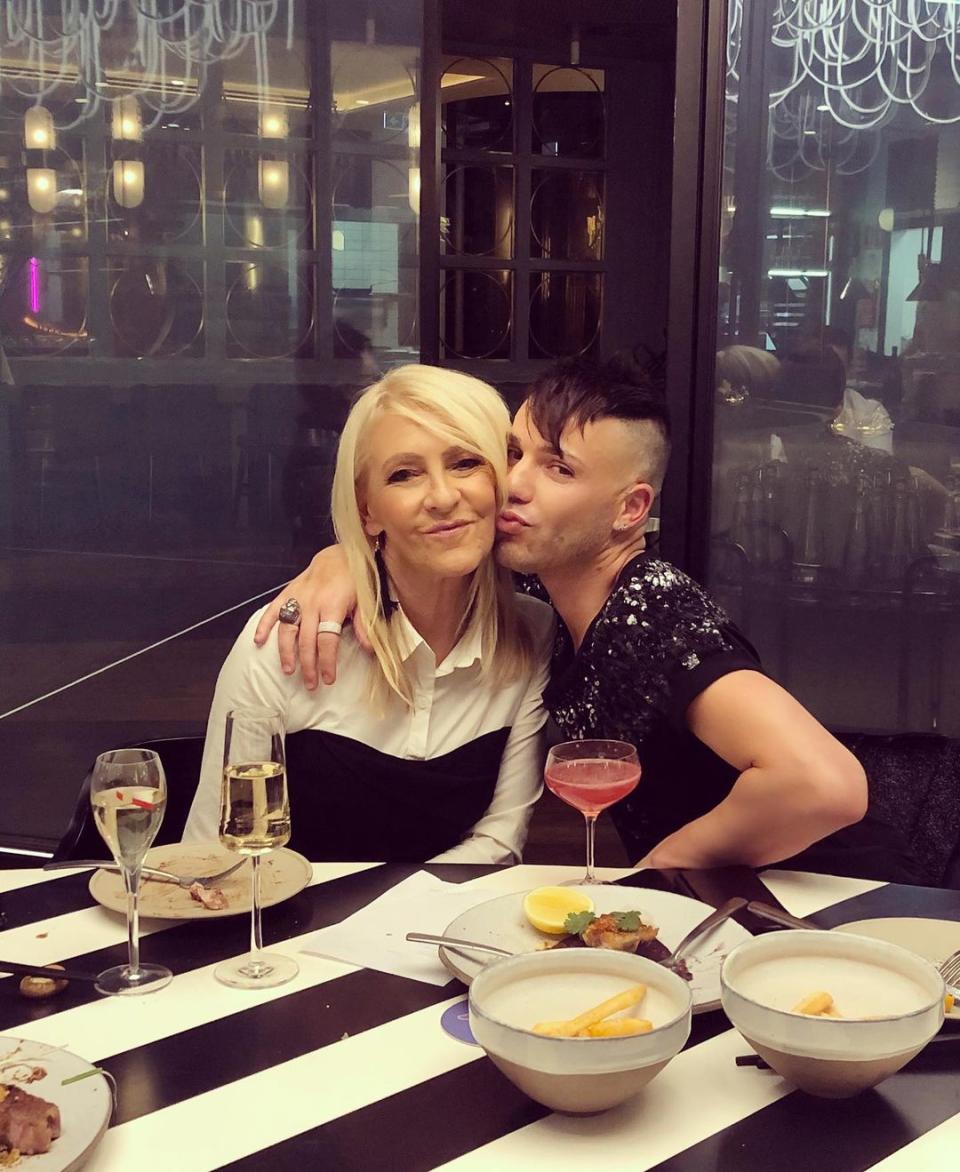 Anthony Callea hugs Jo Hill at a restaurant in Melbourne. Photo: Instagram/anthonycallea.
