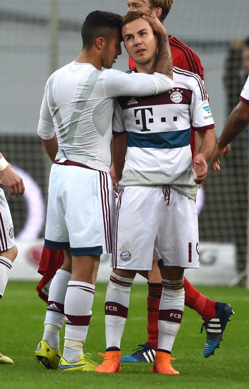 Bayern Munich's Thiago Alcantara and teammate Mario Goetze during their Bundesliga match against Bayer Leverkusen in Leverkusen on May 2, 2015