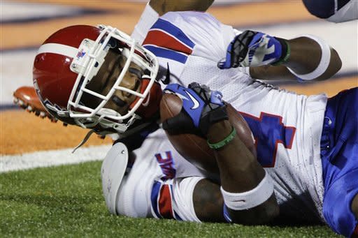 Louisiana Tech wide receiver Quinton Patton (4) holds on to a pass just shy of the end zone during the first half of an NCAA college football game against Illinois on Saturday, Sept. 22, 2012, in Champaign, Ill. (AP Photo/Seth Perlman)