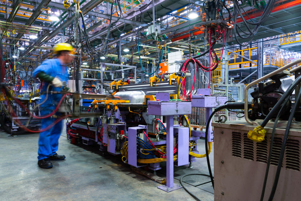 Modern automatic automobile manufacturing workshop. A busy car production line. Industrial scenery background.